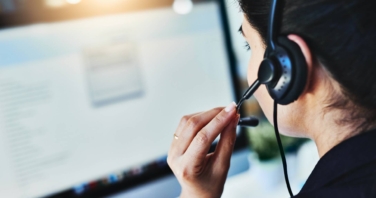 Call centre agent speaking with a customer