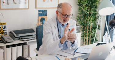 doctor giving online consultation to his patient