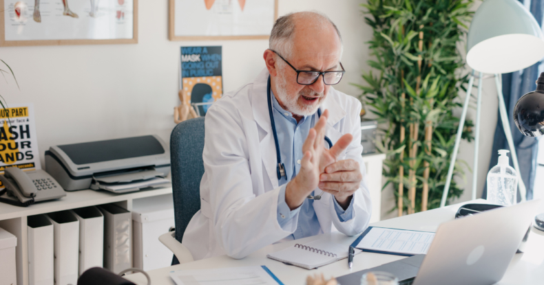 doctor giving online consultation to his patient